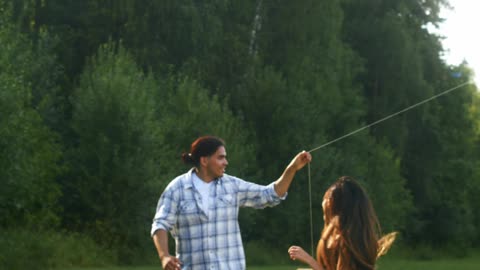 People Playing a Kite