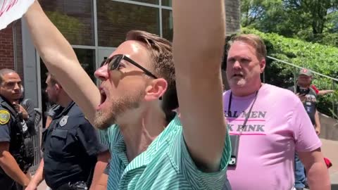 Irony: THIS Protestor Screams that People Need Guns Because they Are Weak