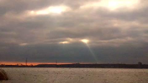 Rays of light make their way through the clouds.