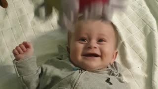 Baby Boy Adorably Cracks Up Every Time Toy Ball Is Dropped On Him