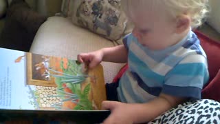 Little boy pretending to read