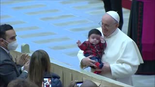 A Sweet moment of Pope Francis with a child