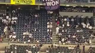 Fans at Yankee Stadium drop a giant “Trump Won” sign
