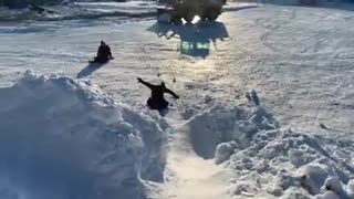 Kids having fun on a sledding hill