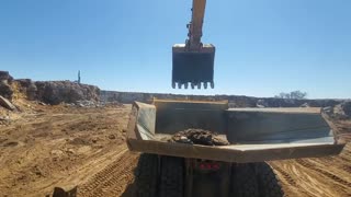 Digging some rock with an excavator
