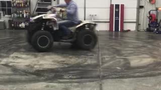 Donuts on a Four Wheeler in a Garage Doesn't go as Planned
