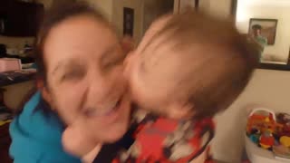 baby kissing mom