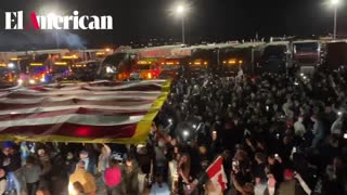"People's Convoy" -Thousands in attendance as people wave 50x150ft. American Flag in Indianapolis, IN.