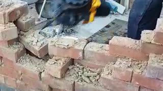 Worker Comically Demonstrates Demolition on Site