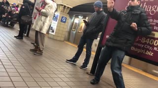 Guy practices his martial arts in subway station