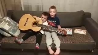 Little brother duo attempt to sing Spanish song
