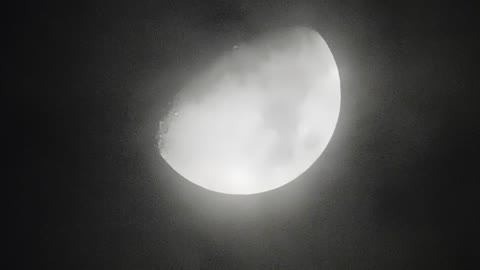 glowing moon in black and white