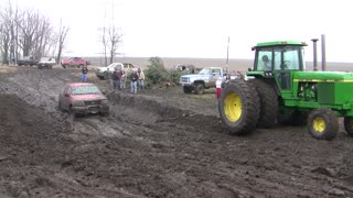 John Deere Trying To Pull Truck From Mud