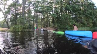 Guy runs across upside canoes and falls