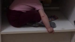 Baby crawls out of the closet