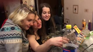 Three girls taking selfie middle girl falls on ground fail