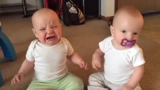 Twin baby girls fight over pacifier_360p