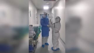 Medic Couple In Touching Hospital Hazmat Reunion