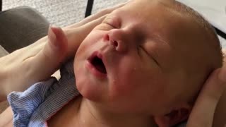 Newborn Baby Enjoys Relaxing Face Massage