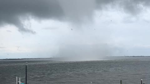 Massive waterspout forms alarming close to house