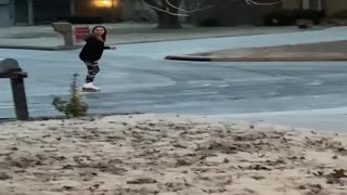 Girl Blissfully Ice Skates around Neighborhood