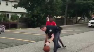 Super cool cop plays basketball with kids