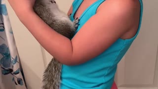 Squirrel Loves Being Held by His Best Friend