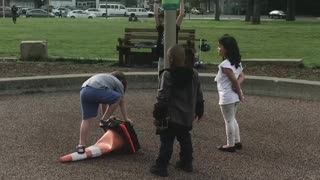 Kids Helping Each Other out at a Playground