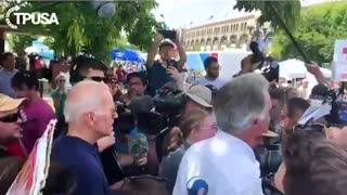 Biden grabs student's arm, answers question on gender