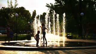Funny Kids Playing With Water Fountain