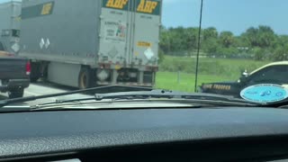 Man Clings to Truck at Highway Speed