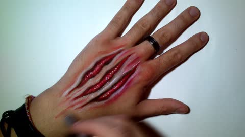This Halloween hand art looks unbelievably real!