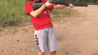 Girl fails at shooting shotgun