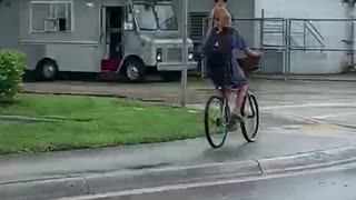 Dog Hitches a Ride on Bicycle Riders Back