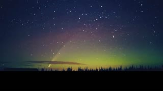 Comet Drifts Though Northern Lights