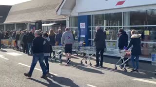 People Line the Block to Enter UK Store