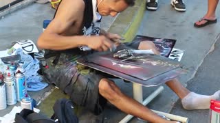 Man making a painting with spray paint in 12 minutes.