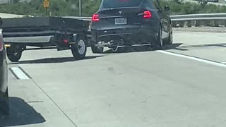 Telsa with Trailer Loses Control