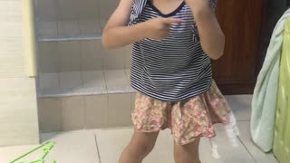Dancing brother wearing dress