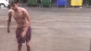 Dude wearing flippers swims in flooded streets