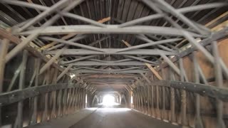 Driving through a covered bridge