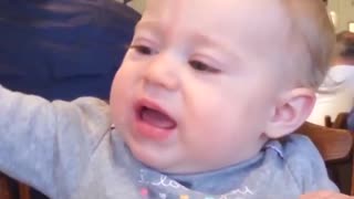 Funny Baby Eating Lemons With Cute Face