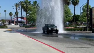 Cars Using Broken Fire Hydrant as Free Car Wash