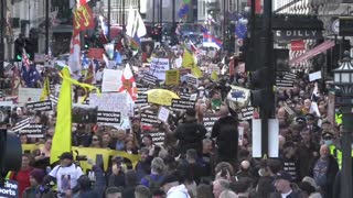 Protesters against covid Passports marching through Piccadilly