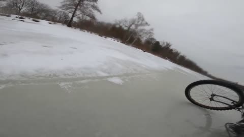 Men Fall Through Ice While Biking on Frozen River