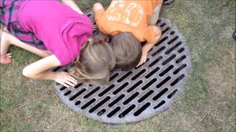 Rescuing a turtle from a storm drain