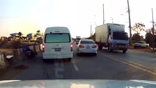 Van Dodging a Turning Car Clips Motorcyclist