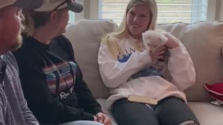 Emotional girl can't hold back tears for surprise puppy