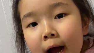 A little girl rapping