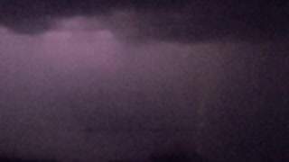 Object Falls from Sky During Slow Motion Lightning Strike